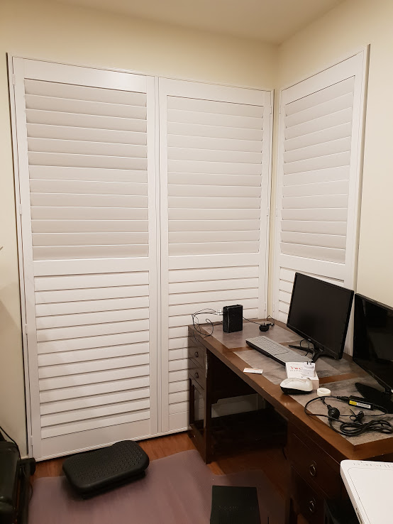 Shutters in a work room with computers