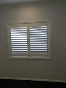 Shutters in a white wall